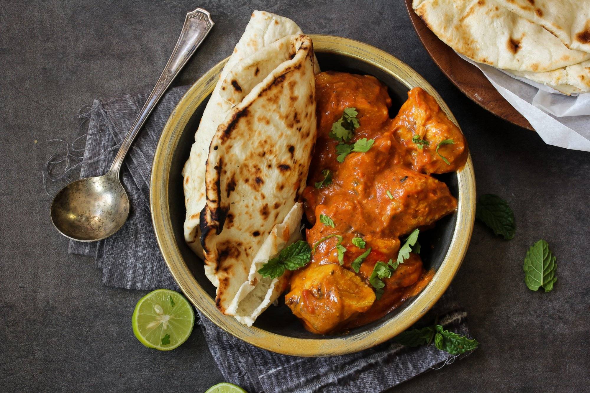 Butter Chicken served with homemade Indian Naan bread Butter Chicken served with homemade Indian Naan bread