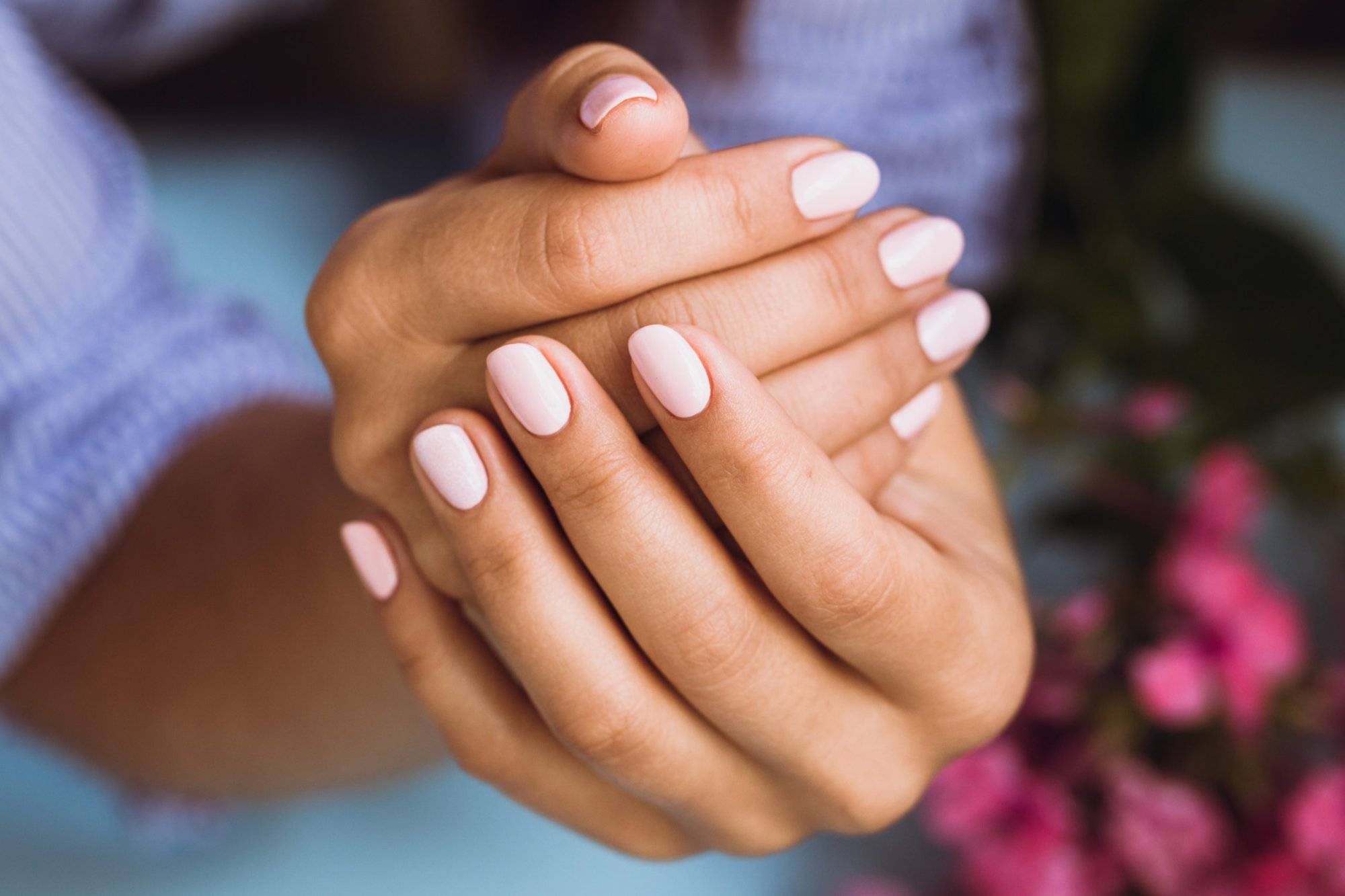Beautiful woman’s nails with beautiful pink manicure Beautiful woman's nails with beautiful pink manicure
