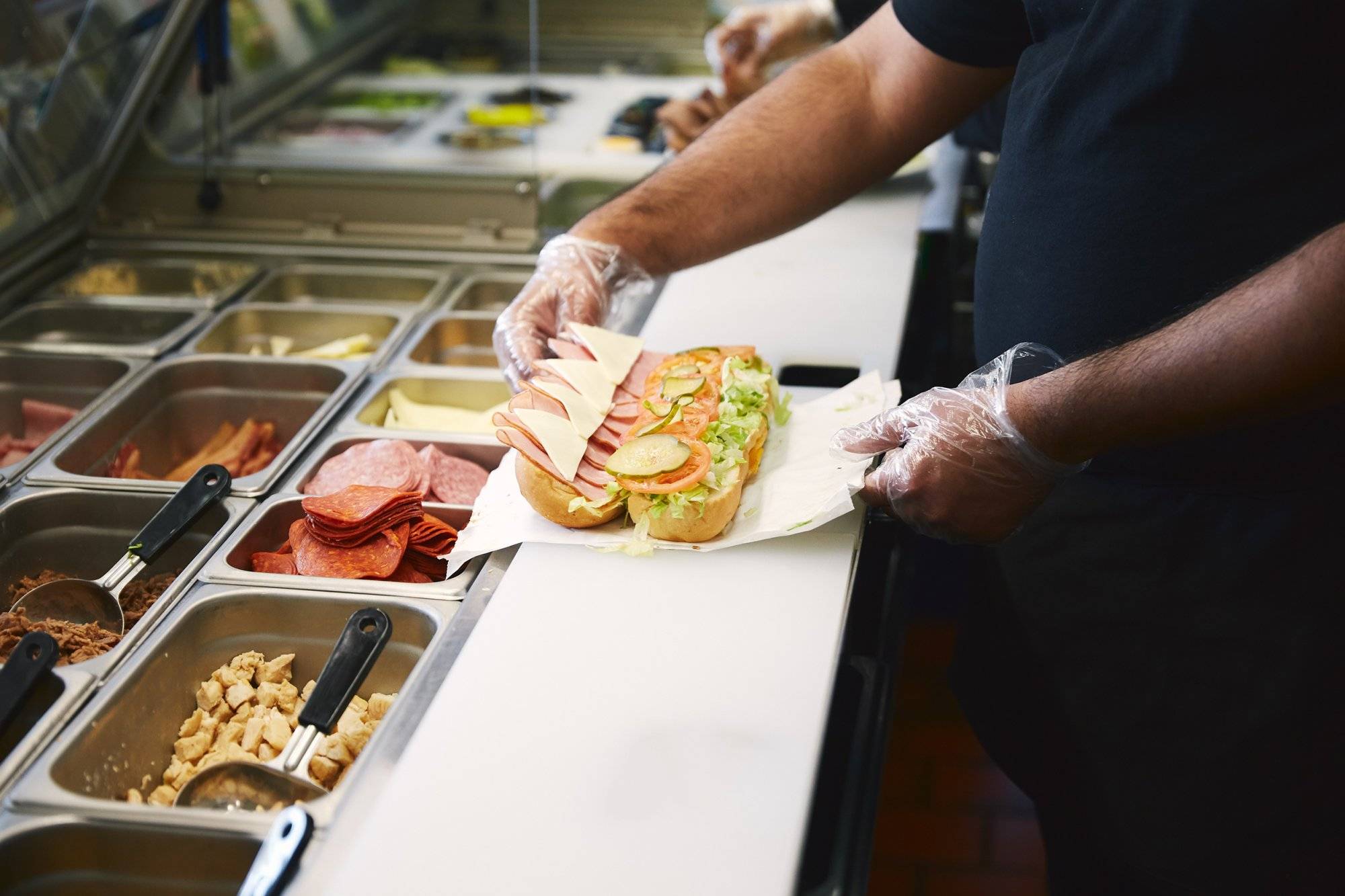 preparing sandwich in the fast food restaurant. preparing sandwich in the fast food restaurant.