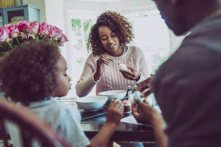 Family colouring Easter eggs at home