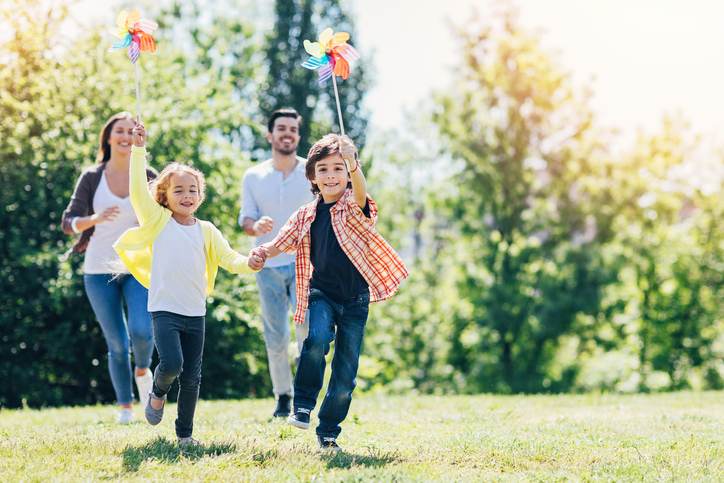 Young family playing in the park