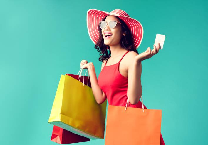 Women are shopping In the summer she is using a credit card and enjoys shopping.